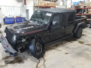 2020 Jeep Gladiator Rubicon z VIN 1C6JJTBG9LL183888, wystawiony jako Copart lot #70225794 z przebiegiem 57 969 mil mil oraz Szkoda całkowita • Salvage title. Historia ofert i sprzedaży dostępna na DreamBid. Obrazek 1.