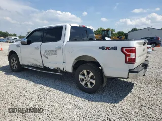 2018 Ford F-150 XL with VIN 1FTEW1EP0JFA28850, listed as a Copart auction lot 63585615 with 210,626 mi miles and Salvage title. Bid and sale history available at DreamBid. Image 2.