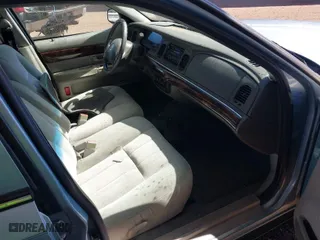 2004 Mercury Grand Marquis GS with VIN 2MEFM74W24X690149, listed as a IAAI auction lot 41842464 with 118,776 mi miles. Bid and sale history available at carsss.com. Image 5.
