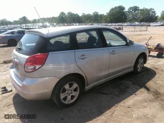 2004 Toyota Matrix Std with VIN 2T1KR32E04C211462, listed as a IAAI auction lot 42084005 with 299,999 mi miles. Bid and sale history available at carsss.com. Image 4.