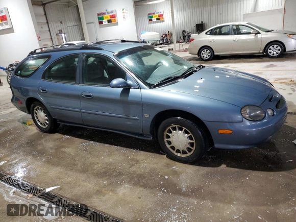 1999 Ford Taurus SE z VIN 1FAFP58S0XG301691, wystawiony jako Copart lot #81920424 z przebiegiem 203 931 mil mil oraz Szkoda całkowita • Salvage title. Historia ofert i sprzedaży dostępna na DreamBid. Obrazek 4.
