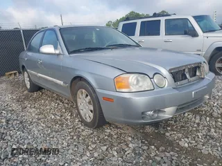 2004 Kia Optima LX z VIN KNAGD126X45335881, wystawiony jako IAAI lot #42655880 z przebiegiem 127 760 mil mil oraz . Historia ofert i sprzedaży dostępna na DreamBid. Obrazek 1.
