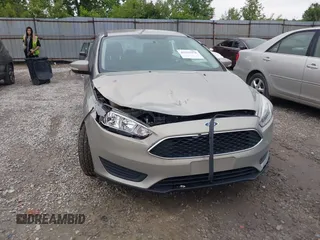 2016 Ford Focus SE z VIN 1FADP3F26GL368544, wystawiony jako IAAI lot #42322376 z przebiegiem 120 535 mil mil oraz . Historia ofert i sprzedaży dostępna na DreamBid. Obrazek 6.