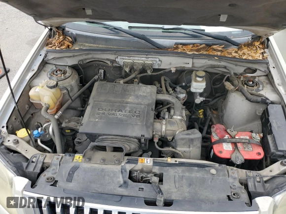 2009 Mercury Mariner Premier with VIN 4M2CU87GX9KJ20726, listed as a Copart auction lot 58690305 with 174,698 mi miles and Salvage title. Bid and sale history available at DreamBid. Image 12.