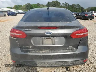 2016 Ford Focus SE z VIN 1FADP3F2XGL253736, wystawiony jako Copart lot #51758415 z przebiegiem 137 904 mil mil oraz Szkoda całkowita • Salvage title. Historia ofert i sprzedaży dostępna na DreamBid. Obrazek 6.