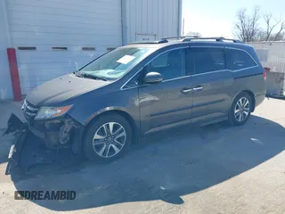 2014 Honda Odyssey Touring with VIN 5FNRL5H97EB101169, listed as a IAAI auction lot 41869233 with 142,147 mi miles and . Bid and sale history available at DreamBid. Image 18.