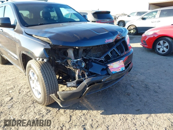 2014 Jeep Grand Cherokee Laredo with VIN 1C4RJEAG3EC218128, listed as a IAAI auction lot 40951611 with 119,596 mi miles and . Bid and sale history available at DreamBid. Image 6.
