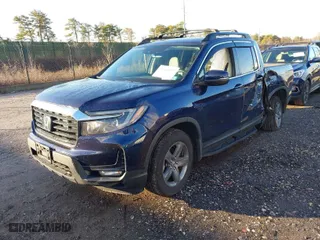 2023 Honda Ridgeline RTL with VIN 5FPYK3F56PB022265, listed as a IAAI auction lot 41144137 with 28,657 mi miles. Bid and sale history available at carsss.com. Image 2.