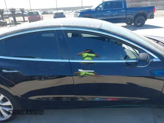 2020 Tesla Model 3 Standard Range Plus with VIN 5YJ3E1EAXLF614002, listed as a IAAI auction lot 41758898 with 42,363 mi miles and . Bid and sale history available at DreamBid. Image 13.