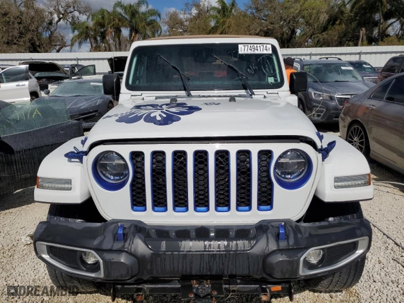 2021 Jeep Wrangler 4xe Unlimited Sahara with VIN 1C4JJXP62MW677073, listed as a Copart auction lot 77494174 with 0 mi miles and Salvage Title. Bid and sale history available at carsss.com. Image 5.