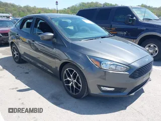 2018 Ford Focus SE z VIN 1FADP3FE6JL223294, wystawiony jako IAAI lot #42067973 z przebiegiem 74 734 mil mil oraz . Historia ofert i sprzedaży dostępna na DreamBid. Obrazek 1.