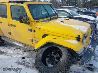 2019 Jeep Wrangler Unlimited Sahara Altitude with VIN 1C4HJXEG3KW580097, listed as a IAAI auction lot 41345888 with 56,592 mi miles. Bid and sale history available at carsss.com. Image 6.