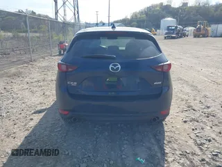 2019 Mazda CX-5 Touring with VIN JM3KFBCM8K0518806, listed as a IAAI auction lot 42038168 with 61,449 mi miles and . Bid and sale history available at DreamBid. Image 16.