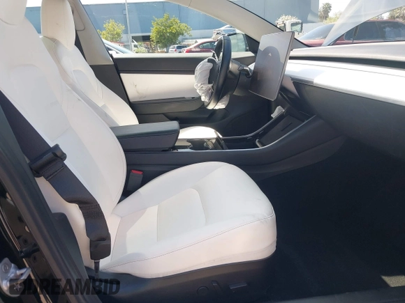 2019 Tesla Model 3 Long Range with VIN 5YJ3E1EB6KF192477, listed as a IAAI auction lot 41981600 with 62,888 mi miles. Bid and sale history available at carsss.com. Image 5.