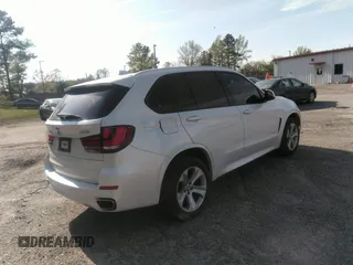 2014 BMW X5 xDrive35i with VIN 5UXKR0C56E0H18800, listed as a IAAI auction lot 40843200 with 129,991 mi miles. Bid and sale history available at carsss.com. Image 4.