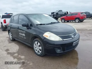 2009 Nissan Versa 1.8 SL with VIN 3N1BC13E79L393141, listed as a IAAI auction lot 42124776 with 233,137 mi miles. Bid and sale history available at carsss.com. Image 1.
