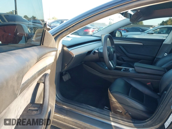 2021 Tesla Model 3 Long Range with VIN 5YJ3E1EBXMF995814, listed as a IAAI auction lot 41838453 with 51,415 mi miles. Bid and sale history available at carsss.com. Image 5.