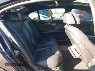 2014 BMW 7 Series 740Li with VIN WBAYE4C56ED137847, listed as a IAAI auction lot 39452255 with 184,471 mi miles. Bid and sale history available at carsss.com. Image 8.