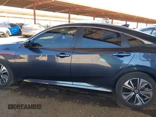 2018 Honda Civic EX-L z VIN JHMFC1F8XJX033602, wystawiony jako IAAI lot #42161015 z przebiegiem 99 597 mil mil oraz . Historia ofert i sprzedaży dostępna na DreamBid. Obrazek 14.