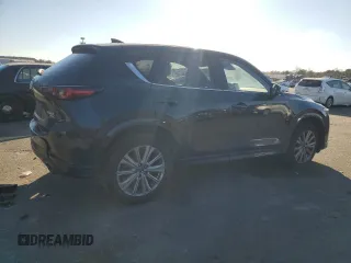 2023 Mazda CX-5 Signature with VIN JM3KFBXYXP0130139, listed as a Copart auction lot 88321445 with 22,911 mi miles and Salvage Title. Bid and sale history available at carsss.com. Image 3.