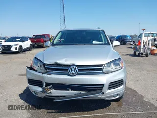 2014 Volkswagen Touareg Sport with VIN WVGEF9BP6ED007436, listed as a IAAI auction lot 41953307 with 114,925 mi miles and . Bid and sale history available at DreamBid. Image 12.