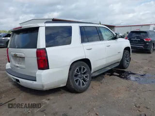 2017 Chevrolet Tahoe LS with VIN 1GNSCAKC5HR312729, listed as a IAAI auction lot 41928484 with 206,999 mi miles and . Bid and sale history available at DreamBid. Image 4.