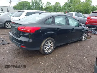 2017 Ford Focus SE z VIN 1FADP3F25HL253466, wystawiony jako IAAI lot #42303404 z przebiegiem 89 779 mil mil oraz . Historia ofert i sprzedaży dostępna na DreamBid. Obrazek 4.