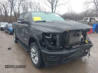 2021 Ram 1500 Laramie z VIN 1C6SRFJT6MN580803, wystawiony jako IAAI lot #41207914 z przebiegiem 56 891 mil mil oraz . Historia ofert i sprzedaży dostępna na DreamBid. Obrazek 1.