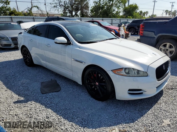 2015 Jaguar XJ with VIN SAJWA1CZ8F8V81637, listed as a Copart auction lot 55619555 with 88,328 mi miles and Salvage Title. Bid and sale history available at DreamBid. Image 4.