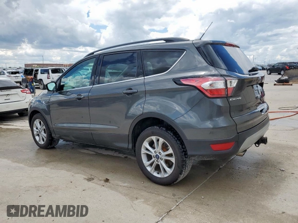 2017 Ford Escape SE z VIN 1FMCU9G91HUE17654, wystawiony jako Copart lot #56173175 z przebiegiem 97 678 mil mil oraz Czysty tytuł • Clean title. Historia ofert i sprzedaży dostępna na DreamBid. Obrazek 2.
