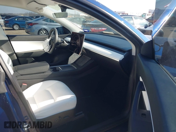 2021 Tesla Model Y Standard Range with VIN 5YJYGDED5MF121874, listed as a IAAI auction lot 41238170 with 72,041 mi miles and . Bid and sale history available at DreamBid. Image 5.