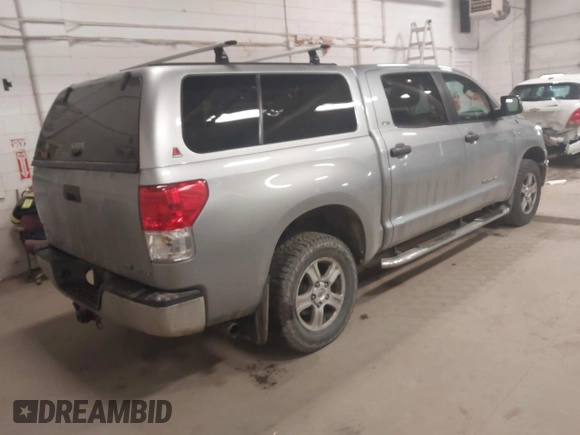 2011 Toyota Tundra 4WD Truck with VIN 5TFDW5F16BX187753, listed as a IAAI auction lot 42003416 with 239,476 mi miles. Bid and sale history available at carsss.com. Image 4.