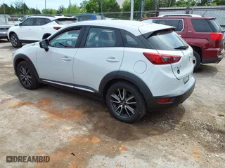 2017 Mazda CX-3 Grand Touring with VIN JM1DKFD78H0160564, listed as a IAAI auction lot 39236942 with 50,921 mi miles. Bid and sale history available at carsss.com. Image 3.