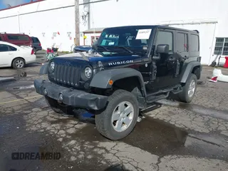 2011 Jeep Wrangler Unlimited Rubicon with VIN 1J4BA6H13BL513311, listed as a IAAI auction lot 41809207 with 124,716 mi miles and . Bid and sale history available at DreamBid. Image 17.