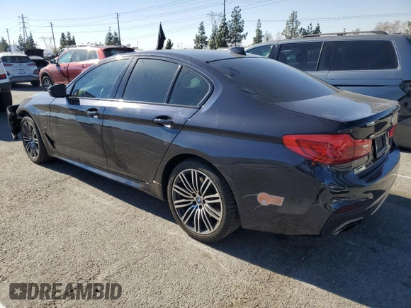 2020 BMW 5 Series 530e with VIN WBAJA9C00LCD60874, listed as a Copart auction lot 87960825 with 91,036 mi miles and Salvage Title. Bid and sale history available at DreamBid. Image 2.