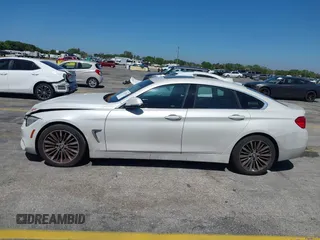 2015 BMW 4 Series 428i with VIN WBA4A5C58FGK15335, listed as a IAAI auction lot 41723243 with 152,652 mi miles and . Bid and sale history available at DreamBid. Image 13.