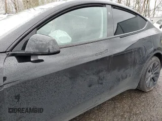 2024 Tesla Model Y Long Range with VIN 7SAYGDEE2RF131085, listed as a Copart auction lot 50171055 with Not Provided miles and Salvage Title. Bid and sale history available at DreamBid. Image 7.
