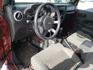 2009 Jeep Wrangler Sahara z VIN 1J4FA54159L789906, wystawiony jako Copart lot #45292375 z przebiegiem 146 992 mil mil oraz Szkoda całkowita • Salvage title. Historia ofert i sprzedaży dostępna na DreamBid. Obrazek 8.