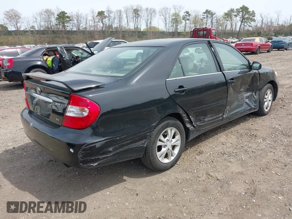 2004 Toyota Camry LE with VIN 4T1BF32KX4U077010, listed as a IAAI auction lot 42039297 with 113,742 mi miles. Bid and sale history available at carsss.com. Image 4.