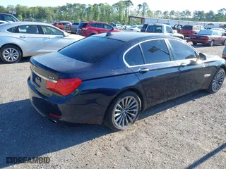 2011 BMW 7 Series 740i with VIN WBAKA4C52BC392112, listed as a IAAI auction lot 41736939 with 125,953 mi miles. Bid and sale history available at carsss.com. Image 4.