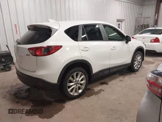 2014 Mazda CX-5 Grand Touring with VIN JM3KE4DY3E0374036, listed as a IAAI auction lot 41889030 with 162,611 mi miles and . Bid and sale history available at DreamBid. Image 4.