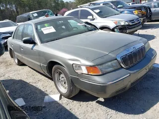 2001 Mercury Grand Marquis LS with VIN 2MEFM75W21X664449, listed as a IAAI auction lot 41898463 with 290,047 mi miles and . Bid and sale history available at DreamBid. Image 1.