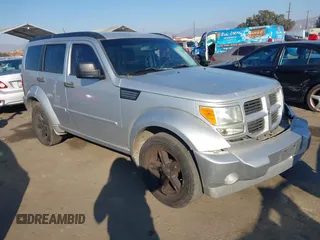 2011 Dodge Nitro SXT z VIN 1D4PT5GK5BW573988, wystawiony jako IAAI lot #41367094 z przebiegiem 148 965 mil mil oraz . Historia ofert i sprzedaży dostępna na DreamBid. Obrazek 1.