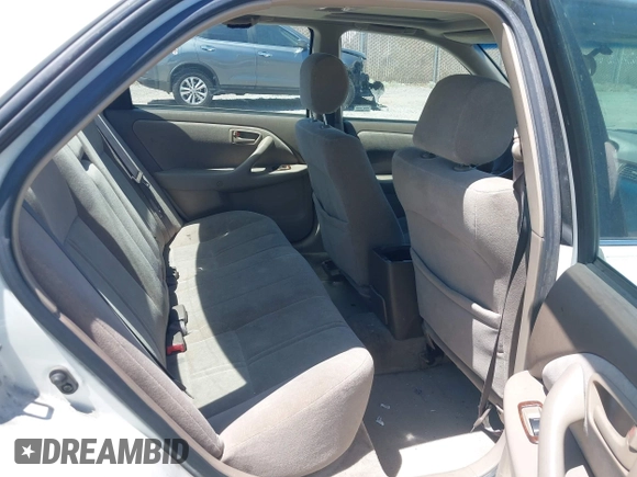 1999 Toyota Camry LE z VIN JT2BG22K3X0342513, wystawiony jako IAAI lot #42371033 z przebiegiem 159 894 mil mil oraz . Historia ofert i sprzedaży dostępna na DreamBid. Obrazek 8.
