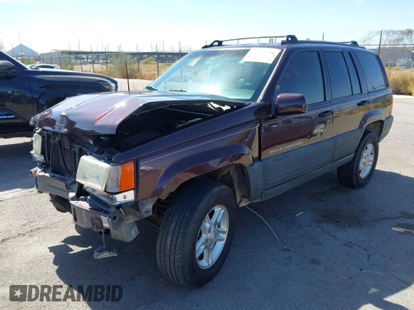 1996 Jeep Grand Cherokee Laredo with VIN 1J4GZ58S3TC391942, listed as a IAAI auction lot 41711778 with 202,765 mi miles. Bid and sale history available at carsss.com. Image 2.