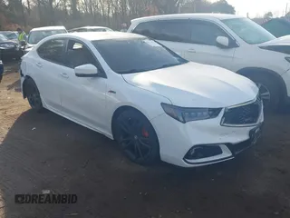 2019 Acura TLX w/A-Spec Pkg z VIN 19UUB2F65KA001243, wystawiony jako IAAI lot #41526680 z przebiegiem 53 506 mil mil oraz . Historia ofert i sprzedaży dostępna na DreamBid. Obrazek 1.