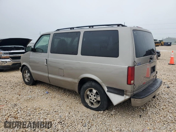 2003 Chevrolet Astro z VIN 1GNEL19X33B102489, wystawiony jako Copart lot #55686585 z przebiegiem 200 050 mil mil oraz Szkody całkowita. Historia ofert i sprzedaży dostępna na DreamBid. Obrazek 2.