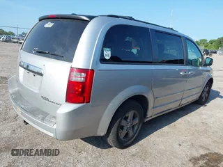 2009 Dodge Grand Caravan SXT z VIN 2D8HN54189R671683, wystawiony jako IAAI lot #42350455 z przebiegiem 220 306 mil mil oraz . Historia ofert i sprzedaży dostępna na DreamBid. Obrazek 4.