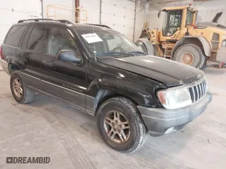 2002 Jeep Grand Cherokee Laredo with VIN 1J4GW48SX2C118434, listed as a IAAI auction lot 42036464 with 187,263 mi miles. Bid and sale history available at carsss.com. Image 1.