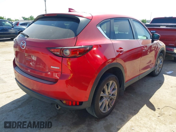 2021 Mazda CX-5 Grand Touring with VIN JM3KFADM4M0476615, listed as a IAAI auction lot 42004814 with 42,483 mi miles. Bid and sale history available at carsss.com. Image 4.